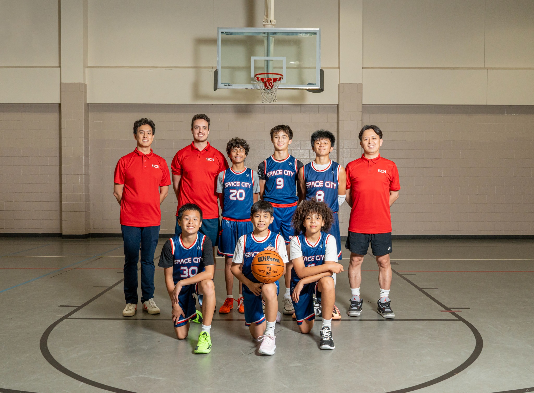 Space City Hoops team with coaches