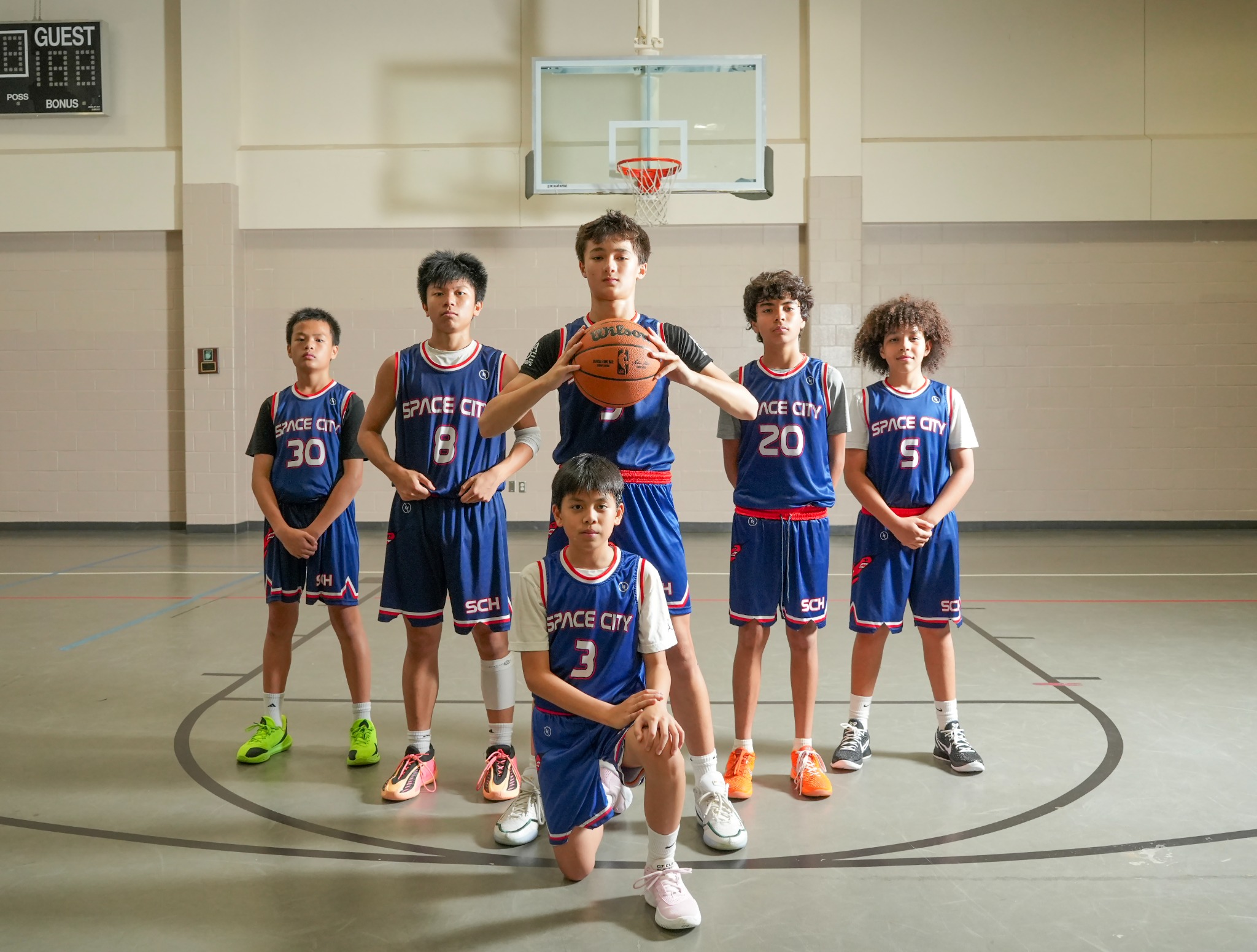 Space City Hoops players posed on the basketball court